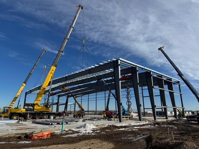 Metal framework construction on a airplane hangar project in Kansas City.